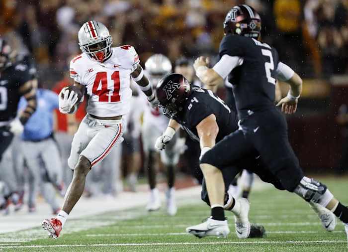 Josh Proctor (41) returns an interception against the Minnesota Golden Gophers. 